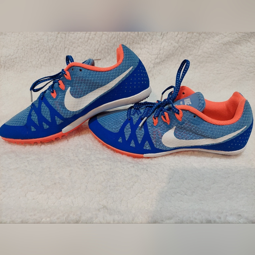 Womans Nike size 8 1/2 spike blue running shoes